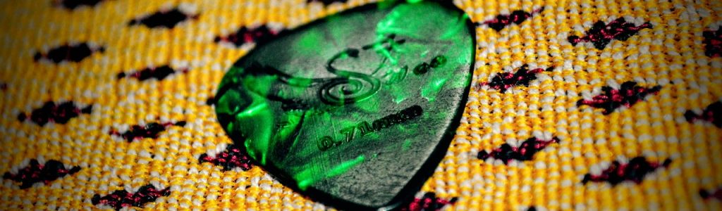 guitar pick, plectrum, green